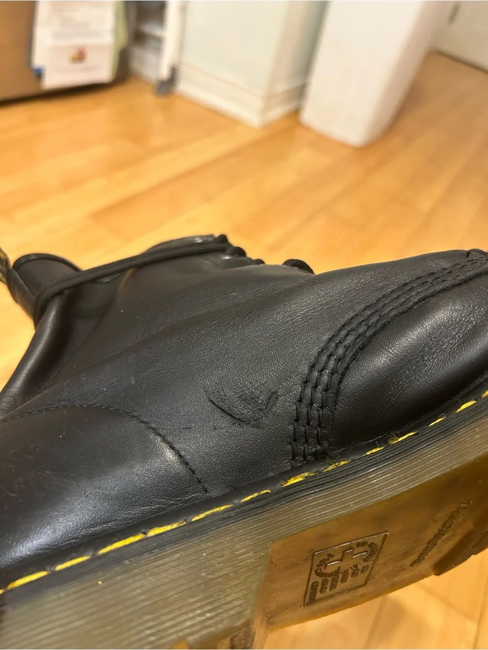 Dr. Martens Black Leather 8-Eye Lace-Up Boots with Yellow Stitching